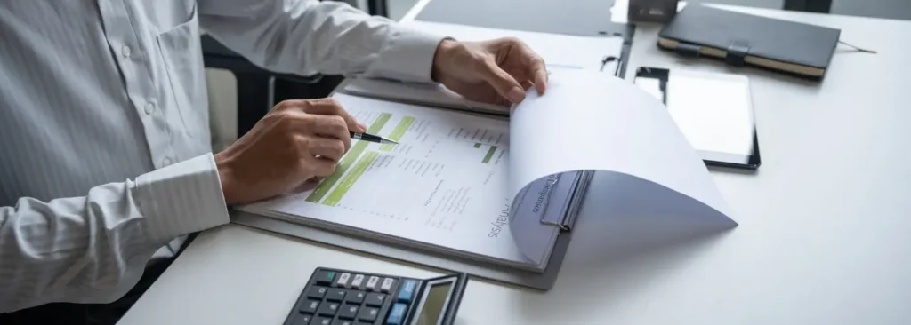 Salesperson reviewing discovery notes after sales discovery listening to a customer